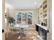 Bright home office with a large window, built-in bookshelves, and plenty of natural light at 50 S Eudora St, Denver, CO 80246