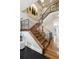 Elegant staircase featuring wrought iron railings and hardwood steps, providing a grand entrance to the home at 50 S Eudora St, Denver, CO 80246
