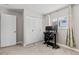 Bedroom featuring neutral walls, carpeting, a computer workstation, and closet with louvered doors at 12543 W Alameda Dr, Lakewood, CO 80228