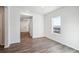 Dining area with wood-look floors and kitchen view at 1273 Bloom St, Brighton, CO 80601