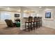 Finished basement featuring a full bar, comfortable seating area, and entertainment options for hosting guests at 1021 Neptunite Pl, Castle Rock, CO 80108
