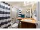 Bathroom with shower/tub combo and striped curtain at 1021 Neptunite Pl, Castle Rock, CO 80108