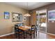 Dining room with a modern light fixture, a mirror, and sliding door access to the outdoor space at 1021 Neptunite Pl, Castle Rock, CO 80108