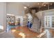 Grand two-story entryway with hardwood floors, curved staircase, and views to dining room at 1021 Neptunite Pl, Castle Rock, CO 80108