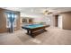 Game room with a pool table, ceiling fan, and neutral carpeting, perfect for entertainment at 1021 Neptunite Pl, Castle Rock, CO 80108