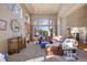 Sunlit living room with a large sectional sofa and decorative accents at 1021 Neptunite Pl, Castle Rock, CO 80108