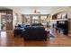 Spacious living room featuring hardwood floors, a fireplace, and plenty of natural light at 1021 Neptunite Pl, Castle Rock, CO 80108