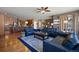 Open concept living room and kitchen with hardwood floors and comfortable seating at 1021 Neptunite Pl, Castle Rock, CO 80108