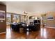 Bright living room featuring hardwood floors, fireplace, and abundant natural light at 1021 Neptunite Pl, Castle Rock, CO 80108