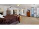 Spacious main bedroom with a fireplace, large windows, and a connecting sitting area at 1021 Neptunite Pl, Castle Rock, CO 80108