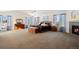Spacious main bedroom with a fireplace and large windows at 1021 Neptunite Pl, Castle Rock, CO 80108
