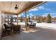 Spacious patio with seating area, perfect for outdoor entertaining at 1021 Neptunite Pl, Castle Rock, CO 80108