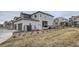 Well-maintained backyard with a grassy area and a view of neighboring homes at 12345 Festival Ln, Thornton, CO 80241
