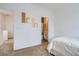 Cozy bedroom with neutral tones, complemented by two modern art pieces at 12345 Festival Ln, Thornton, CO 80241
