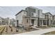 Charming two-story home featuring a mix of siding and brick, offering a modern and inviting curb appeal at 12345 Festival Ln, Thornton, CO 80241