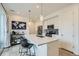 Bright kitchen with a large island, stainless steel appliances, and modern pendant lighting at 12345 Festival Ln, Thornton, CO 80241