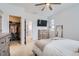 Bright bedroom featuring a ceiling fan, walk-in closet, and ensuite bathroom at 12345 Festival Ln, Thornton, CO 80241