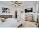 Spacious main bedroom with walk-in closet, ceiling fan, and neutral decor at 12345 Festival Ln, Thornton, CO 80241