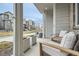 Cozy front porch with seating and an inviting view of the neighborhood at 12345 Festival Ln, Thornton, CO 80241