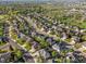 Aerial view of residential neighborhood with tree-lined streets at 10631 Clarke Farms Dr, Parker, CO 80134
