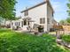 Backyard with outdoor patio, seating, and well-maintained lawn at 10631 Clarke Farms Dr, Parker, CO 80134