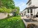 Well-maintained backyard with lush green lawn and patio seating area at 10631 Clarke Farms Dr, Parker, CO 80134