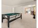 Basement showcasing a pool table and a doorway to an office at 10631 Clarke Farms Dr, Parker, CO 80134