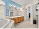 Bathroom with a double vanity, soaking tub, walk-in closet, and neutral carpet at 10631 Clarke Farms Dr, Parker, CO 80134