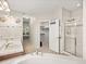 Bathroom with a walk-in closet, double sinks, separate shower, and neutral color palette at 10631 Clarke Farms Dr, Parker, CO 80134