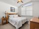 Cozy bedroom with natural light, a comfortable bed, and matching nightstands at 10631 Clarke Farms Dr, Parker, CO 80134