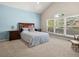 Bedroom with a large window, vaulted ceiling, and neutral carpet offers a serene retreat at 10631 Clarke Farms Dr, Parker, CO 80134