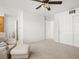 Large room showing neutral walls, carpet, and a doorway to a bathroom at 10631 Clarke Farms Dr, Parker, CO 80134