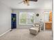 Bonus room with neutral walls, carpeting, a large window, and a comfy chair at 10631 Clarke Farms Dr, Parker, CO 80134