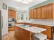 Well-equipped kitchen with island cooktop, granite counters and ample cabinet space at 10631 Clarke Farms Dr, Parker, CO 80134