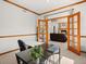 Inviting home office with adjacent living area featuring a fireplace and comfortable seating at 10631 Clarke Farms Dr, Parker, CO 80134