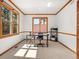 Bright office space with natural light, neutral walls and trim, and a modern desk and chair at 10631 Clarke Farms Dr, Parker, CO 80134