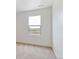 A bright bedroom featuring a large window with views of the neighborhood at 27574 E Byers Ave, Aurora, CO 80018