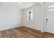 Bright entry with wood-look floors, white walls, and natural light at 27574 E Byers Ave, Aurora, CO 80018