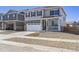 Two-story house with a two-car garage and gravel landscaping at 27574 E Byers Ave, Aurora, CO 80018