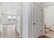 Hallway with white walls, doors and view to living space at 27574 E Byers Ave, Aurora, CO 80018
