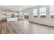 Spacious living area featuring modern kitchen and natural light at 27574 E Byers Ave, Aurora, CO 80018