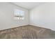 Bright bedroom with neutral carpet and a window at 2036 S Vance Way, Lakewood, CO 80227