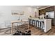 Stylish kitchen features a breakfast bar with seating and sleek, modern appliances at 2036 S Vance Way, Lakewood, CO 80227