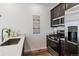 Close-up view of the kitchen area with stainless steel appliances, quartz countertops, and a modern sink at 2036 S Vance Way, Lakewood, CO 80227