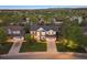 An aerial shot showcases the home's location within a neighborhood at 9810 Townsville Cir, Highlands Ranch, CO 80130