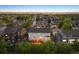 Aerial view of the backyard shows a deck, privacy landscaping, and mountain views at 9810 Townsville Cir, Highlands Ranch, CO 80130