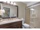 Updated bathroom featuring marble counters, modern vanity, glass shower, and neutral color palette at 9810 Townsville Cir, Highlands Ranch, CO 80130