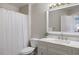 Bright bathroom with a shower and tub combination, and a white marble-topped vanity at 9810 Townsville Cir, Highlands Ranch, CO 80130