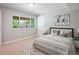 Neutral bedroom featuring carpet, a window with views, and cozy decor at 9810 Townsville Cir, Highlands Ranch, CO 80130