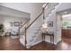 Entryway with hardwood floors and a carpeted staircase at 9810 Townsville Cir, Highlands Ranch, CO 80130